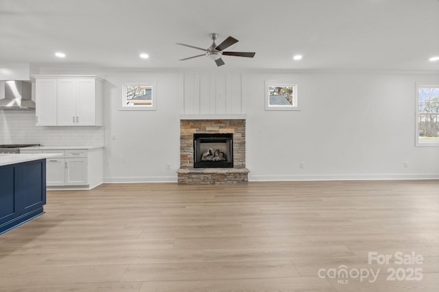 8078 Blackwood Rd, Denver, NC 28037 - unfurnished living room with light wood-style floors, ceiling fan, recessed lighting, baseboards, and a fireplace