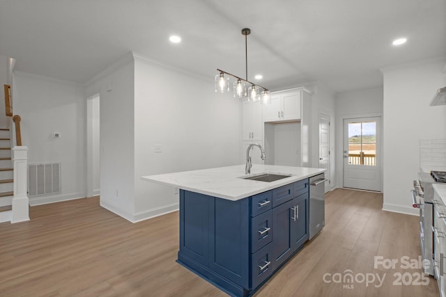 8078 Blackwood Rd, Denver, NC 28037 - kitchen with a sink, blue cabinetry, crown molding, white cabinets, and light wood finished floors