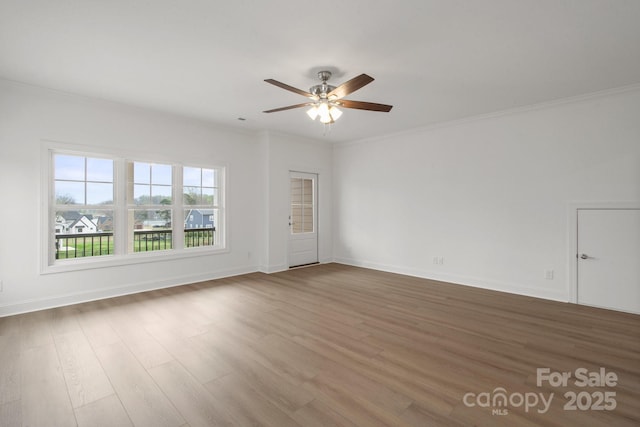 8078 Blackwood Rd, Denver, NC 28037 - spare room featuring a ceiling fan, wood finished floors, baseboards, and crown molding