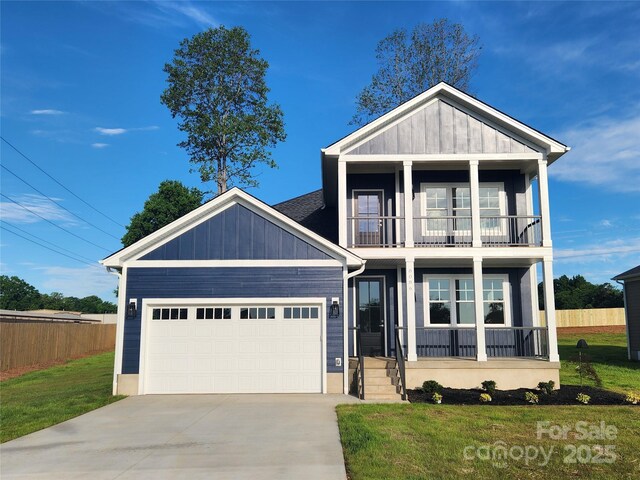 8078 Blackwood Rd, Denver, NC 28037 - view of front of house featuring a balcony, a garage, driveway, and a porch