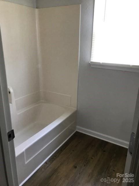 bathroom with  shower combination and hardwood / wood-style flooring