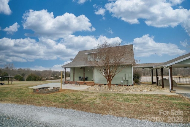 view of front of property with a front yard and covered porch