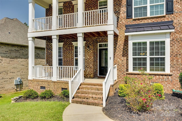 entrance to property with a balcony