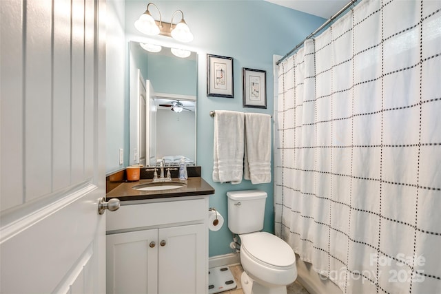 bathroom with toilet, ceiling fan, tile patterned floors, and vanity