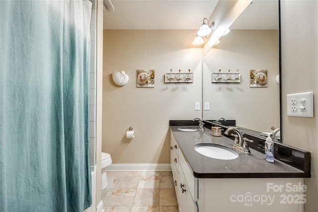 bathroom featuring toilet and vanity