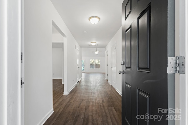 corridor featuring dark hardwood / wood-style flooring