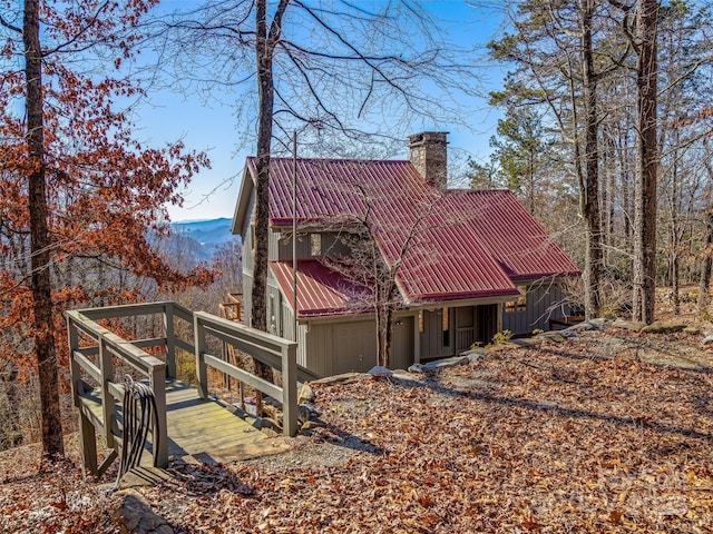 back of property featuring a mountain view