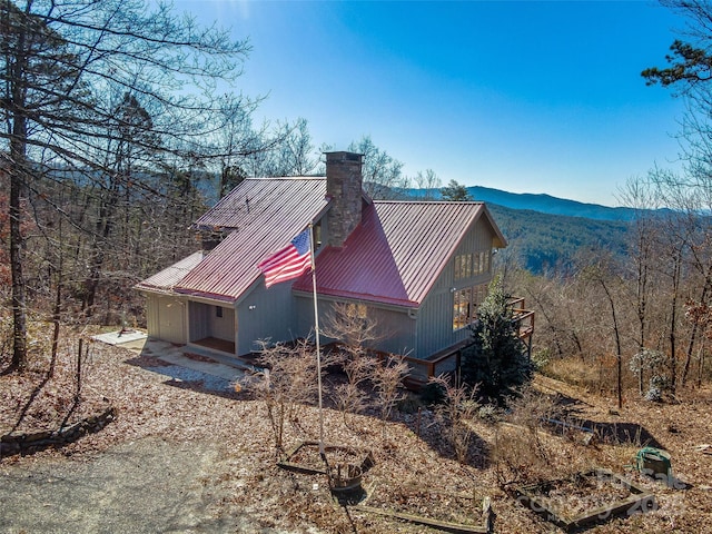 view of side of home with a mountain view