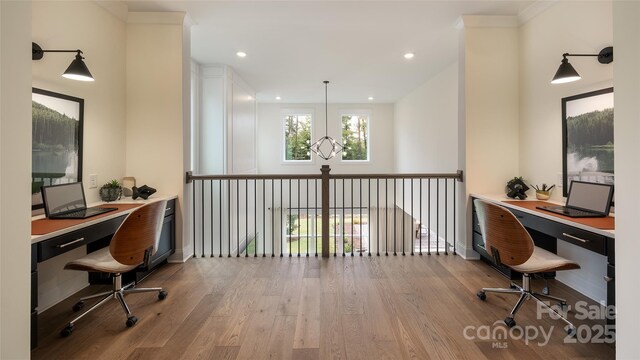 office featuring built in study area, baseboards, wood finished floors, and recessed lighting