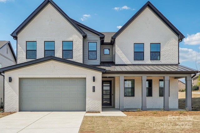 604 Hyder Trl, Tega Cay, SC 29708 - view of front of property with a porch, driveway, brick siding, a standing seam roof, and a garage