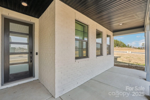 604 Hyder Trl, Tega Cay, SC 29708 - doorway to property with brick siding and a porch
