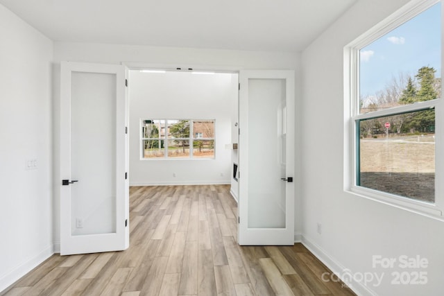 604 Hyder Trl, Tega Cay, SC 29708 - hall featuring light wood finished floors and baseboards