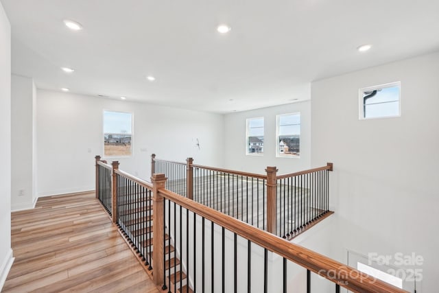 604 Hyder Trl, Tega Cay, SC 29708 - corridor featuring light wood-style floors, an upstairs landing, plenty of natural light, recessed lighting, and baseboards