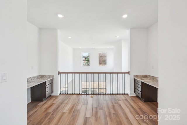 604 Hyder Trl, Tega Cay, SC 29708 - bar area with built in desk, light wood-style flooring, and recessed lighting
