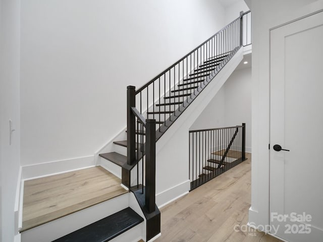 2534 Weddington Ave Unit 11, Charlotte, NC 28204 - stairs featuring wood finished floors and baseboards