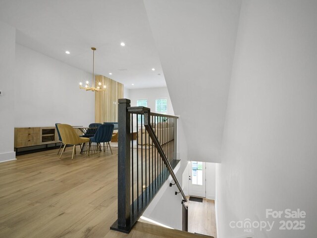 2530 Weddington Ave Unit 12, Charlotte, NC 28204 - stairway featuring wood finished floors, recessed lighting, a chandelier, and baseboards