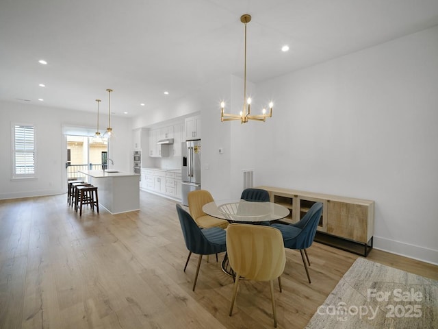 2530 Weddington Ave Unit 12, Charlotte, NC 28204 - dining area with light wood-style floors, a chandelier, baseboards, and recessed lighting