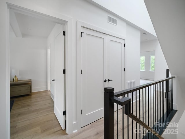 2530 Weddington Ave Unit 12, Charlotte, NC 28204 - hall with light wood-style flooring, baseboards, and an upstairs landing