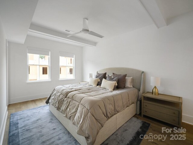 2530 Weddington Ave Unit 12, Charlotte, NC 28204 - bedroom with wood finished floors, beamed ceiling, baseboards, and a ceiling fan