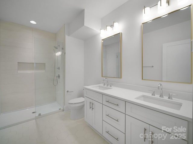 2530 Weddington Ave Unit 12, Charlotte, NC 28204 - bathroom featuring a tile shower, toilet, double vanity, and tile patterned floors