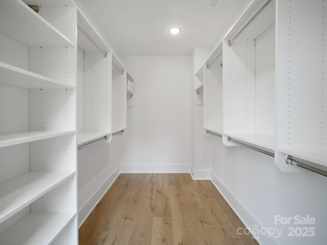 2530 Weddington Ave Unit 12, Charlotte, NC 28204 - walk in closet with light wood-style flooring