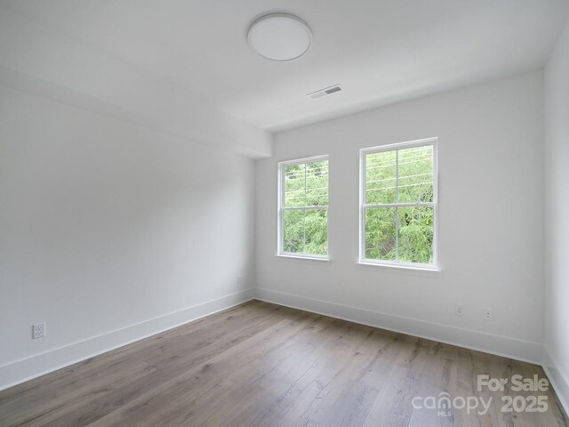 2530 Weddington Ave Unit 12, Charlotte, NC 28204 - empty room with baseboards and wood finished floors