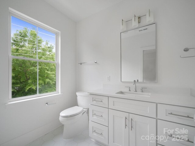 2530 Weddington Ave Unit 12, Charlotte, NC 28204 - bathroom featuring vanity, toilet, and tile patterned flooring