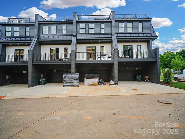 2530 Weddington Ave Unit 12, Charlotte, NC 28204 - rear view of property featuring a standing seam roof, metal roof, and a balcony