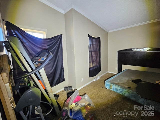 bedroom featuring ornamental molding and a textured ceiling