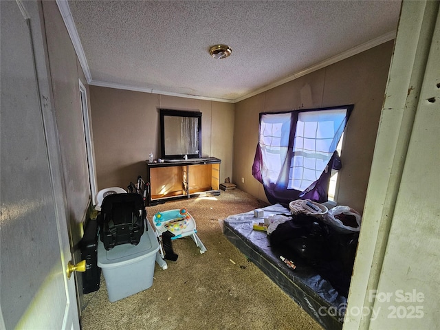 carpeted bedroom with a textured ceiling and ornamental molding