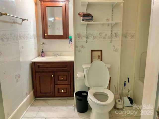 full bathroom with vanity, separate shower and tub, tile walls, and toilet