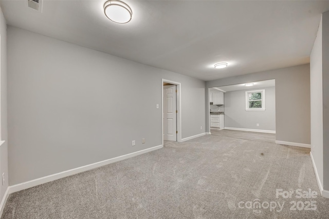 interior space featuring light colored carpet