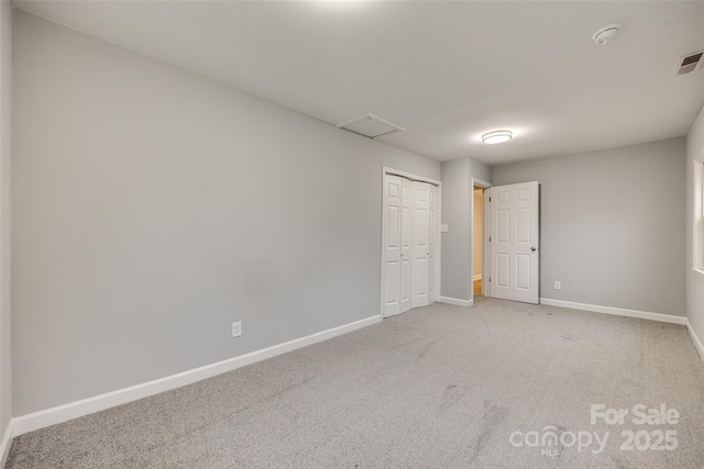 unfurnished room featuring carpet flooring