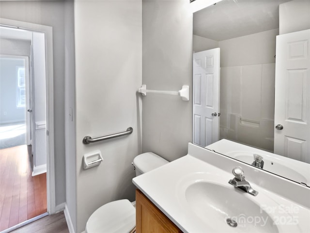 bathroom with toilet and vanity