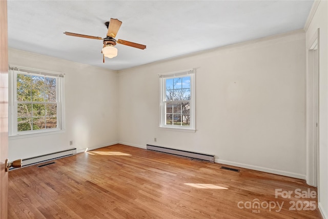 unfurnished room with ceiling fan, light hardwood / wood-style flooring, ornamental molding, and a baseboard radiator