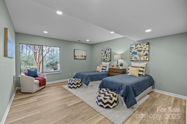 bedroom with recessed lighting, baseboards, and wood finished floors