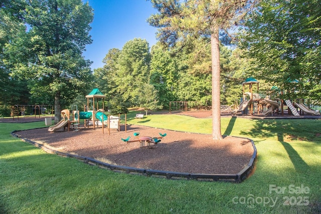 community jungle gym featuring a yard