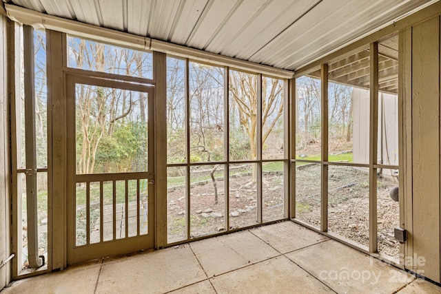 unfurnished sunroom with a healthy amount of sunlight