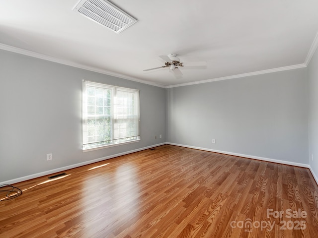 unfurnished room featuring ceiling fan, ornamental molding, and light hardwood / wood-style floors