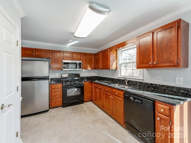 kitchen with sink, black appliances, crown molding, and dark stone counters