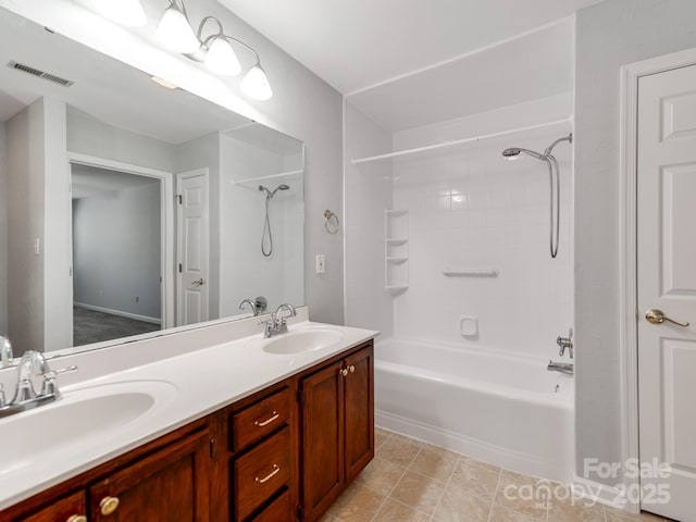 bathroom featuring shower / bathtub combination and vanity