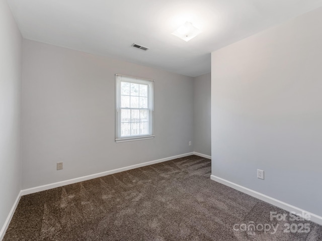 empty room featuring carpet flooring