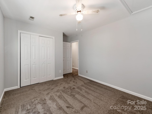 unfurnished bedroom with ceiling fan, a closet, and carpet floors