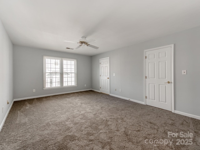 spare room with ceiling fan and carpet flooring