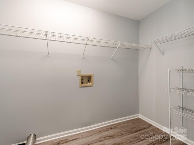 laundry area with hookup for a washing machine and hardwood / wood-style floors