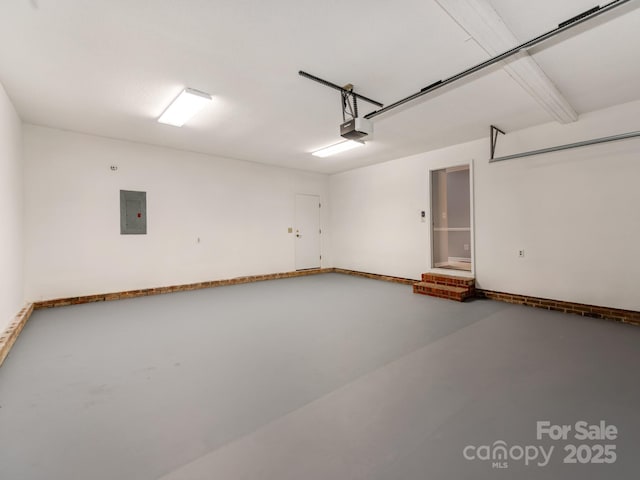 garage featuring a garage door opener and electric panel