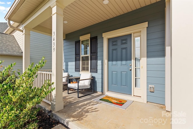 property entrance featuring covered porch