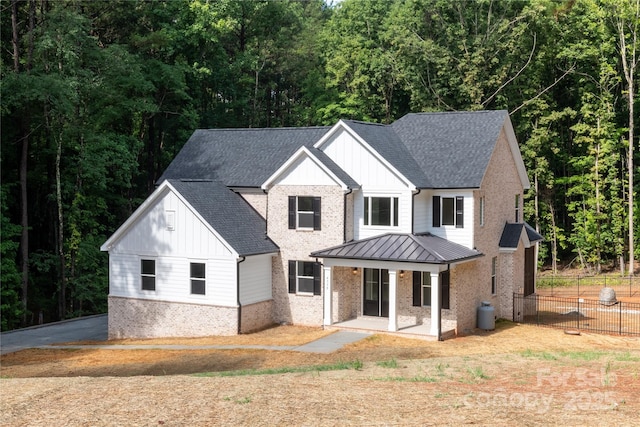 modern farmhouse featuring covered porch