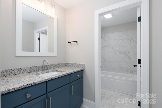 bathroom featuring vanity and tiled shower / bath combo