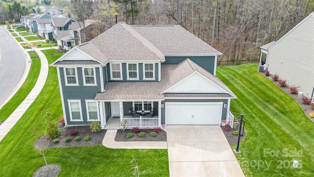 view of front of house featuring covered porch and a front lawn